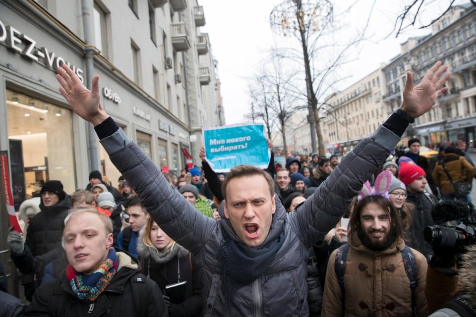 Navalny, centre, attending a rally in Moscow in 2018 (AP)