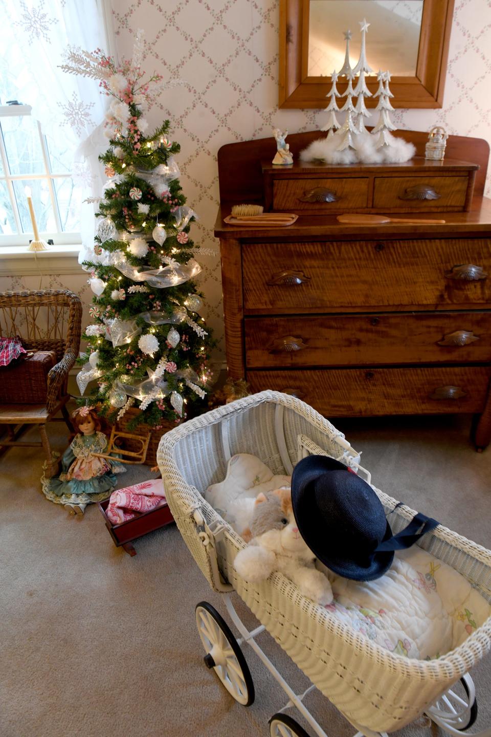 A bedroom in the Stewart Manor House is decorated for "Welcome Home for the Holidays" and "Deck the Hollow" at Quail Hollow Park in Lake Township. The event is 5 to 8:30 p.m. Friday, Saturday and Sunday; Dec. 15-17; and Dec. 19-20.