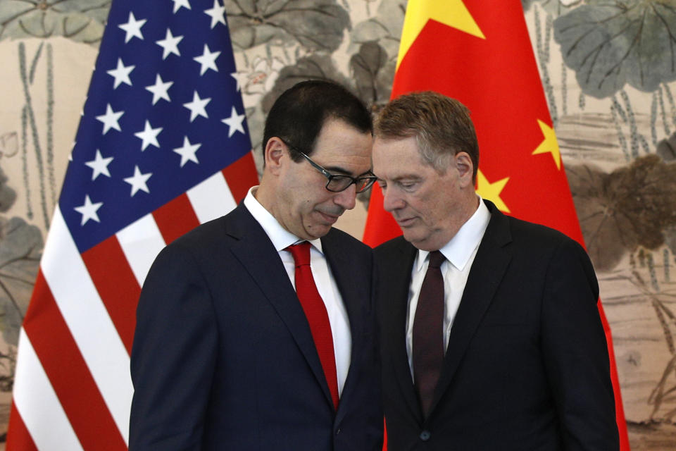 U.S. Treasury Secretary Steven Mnuchin, left, and his Trade Representative Robert Lighthizer arrive for a group photo session after their meeting with Chinese Vice Premier Liu He, at the Diaoyutai State Guesthouse in Beijing, Wednesday, May 1, 2019. (AP Photo/Andy Wong, Pool)