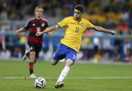 Brazil's Oscar scores a goal during the 2014 World Cup semi-finals between Brazil and Germany at the Mineirao stadium in Belo Horizonte July 8, 2014. REUTERS/Marcos Brindicci (BRAZIL - Tags: TPX IMAGES OF THE DAY SOCCER SPORT WORLD CUP)