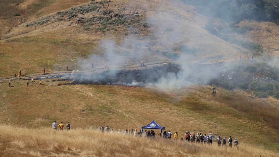 Observers to the first cultural burn in San Luis Obispo County in over a century. The yak tit?u tit?u yak tilhini Northern Chumash Tribe lead a 15-acre cultural burn at the Johnson Ranch Open Space on Tuesday. June 18, 2024. Several agencies were also involved including Calfire, San Luis Obispo City Fire Department, and resource conservation agencies from the city, county and state.