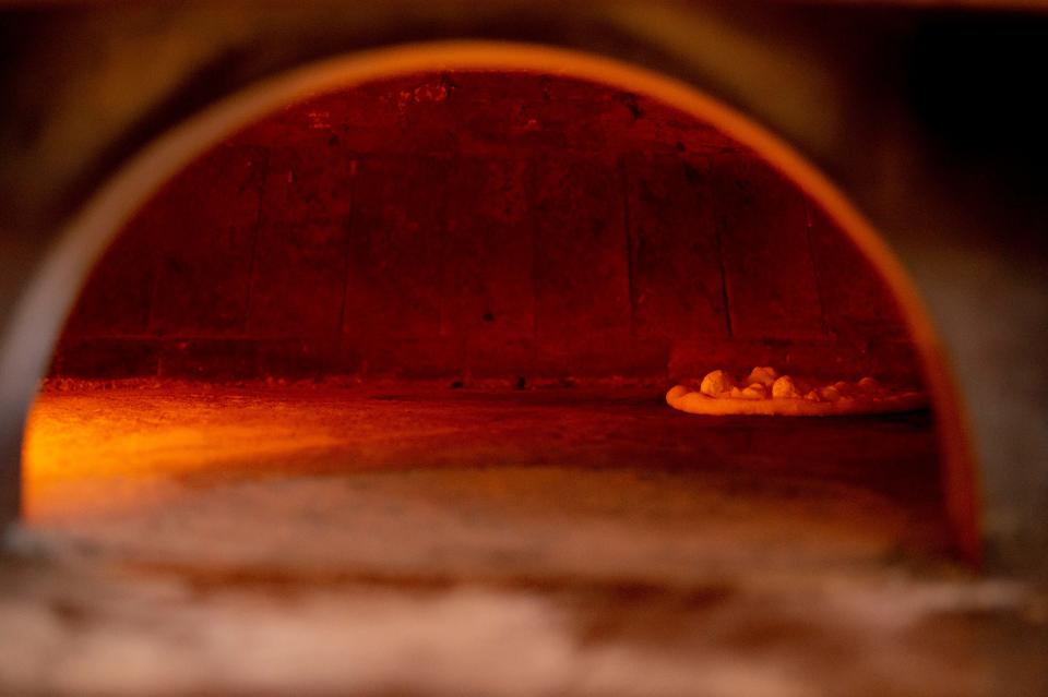 A pizza cooks at DeSano Pizzeria inside Assembly Food Hall  in Nashville , Tenn., Monday, May 29, 2023.