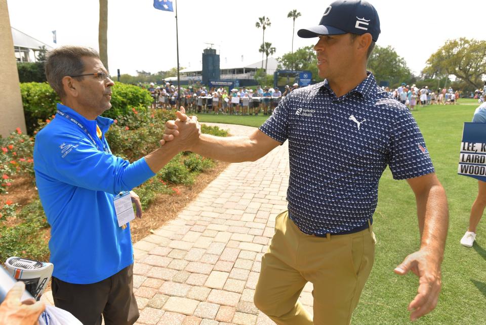 Golfweek/USA TODAY golf writer Steve DiMeglio is greeted by golfer Gary Woodland as Woodland finished his second round at The Players Championship.