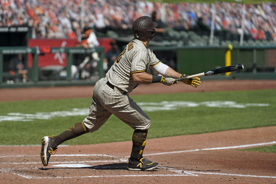 San Diego Padres' Mitch Moreland hits an RBI double to deep left field in the fourth inning of a baseball game against the San Francisco Giants Sunday, Sept. 27, 2020, in San Francisco. (AP Photo/Eric Risberg)