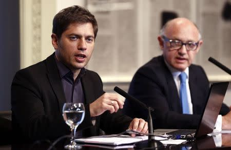 Argentina's Economy Minister Axel Kicillof (L) speaks next to Foreign Minister Hector Timerman during a news conference at the Casa Rosada Presidential Palace in Buenos Aires August 29, 2014. REUTERS/Marcos Brindicci