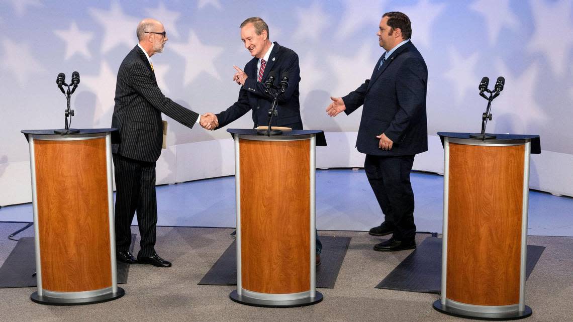 Incumbent U.S. Sen. Mike Crapo, R-Idaho, center, shakes the hands of opponents Scott Cleveland, an independent, left, and Democratic candidate David Roth following a debate at Idaho Public Television, Monday, Oct. 3, 2022, in Boise.