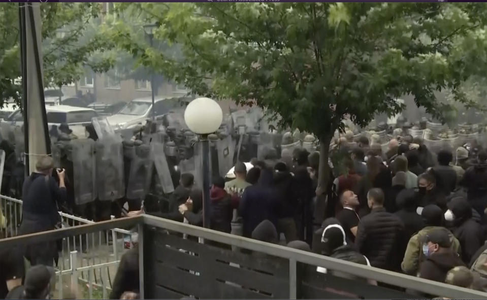 In this grab taken from video, KFOR soldiers guard a municipal building after clashes with Kosovo Serbs in the town of Zvecan, northern Kosovo, Monday, May 29, 2023. Ethnic Serbs in northern Kosovo have clashed with troops from the NATO-led KFOR peacekeeping force outside a municipal building. They were trying to take over one of the local government offices where ethnic Albanian mayors entered last week with the help of the authorities. (AP Photo)