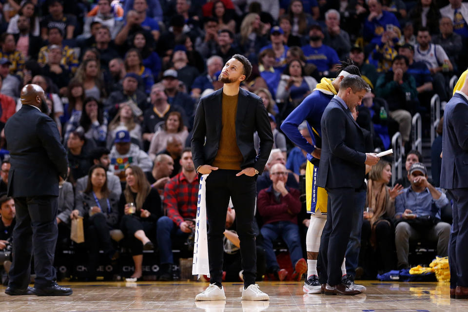 After breaking his hand in October, Steph Curry is still expected to be evaluated again on February 1. (Lachlan Cunningham/Getty Images)
