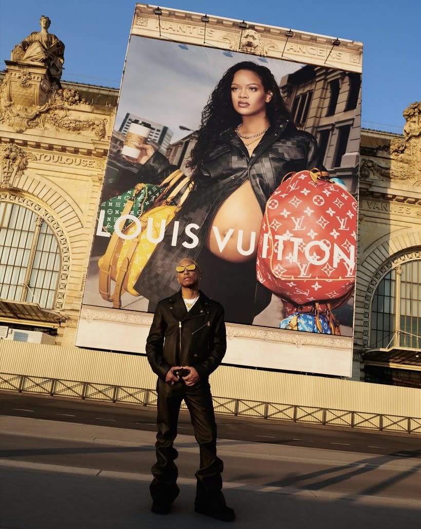 Pharrell Williams in front of the new campaign's billboard of Louis Vuitton at Musée d'Orsay in Paris, pregnant rihanna louis vuitton ad, baby bump