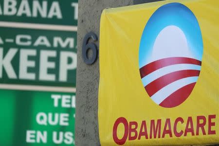 A sign on an insurance store advertises Obamacare in San Ysidro, San Diego, California, U.S., October 26, 2017. REUTERS/Mike Blake/Files