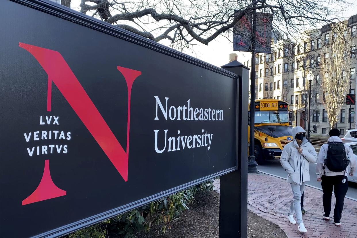 FILE - Students walk on the Northeastern University campus in Boston on Jan. 31, 2019. 