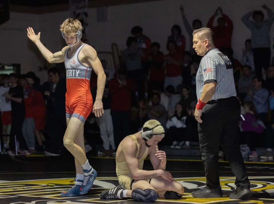 Jackson Liberty's Tucker Pazinko (left) was one of the Shore Conference wrestling stars last week.