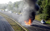 A Renault Scenic burst into flames on the M42 last Saturday morning, caught in this shocking image. The family inside fortunately escaped before the flames spread inside, after which the vehicle turned into a fireball. The cause of the fire is still unknown. Photo: SWNS