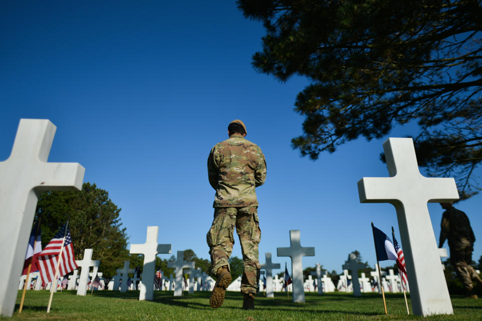 U/S. military walks between Headstone ahead the Franco-American Memorial Ceremony of 75th D-Day anniversary at Normandy American Cemetery in Colleville-sur-Mer.On Thursday, June 6, 2019, in Colleville-sur-Mer, Normandy, France. (Photo by Artur Widak/NurPhoto via Getty Images)