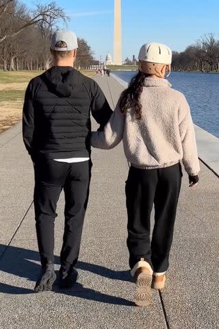 <p>Derek Hough/ Instagram</p> Derek Hough and wife Hayley Erbert walk in Washington, D.C. following her emergency craniectomy