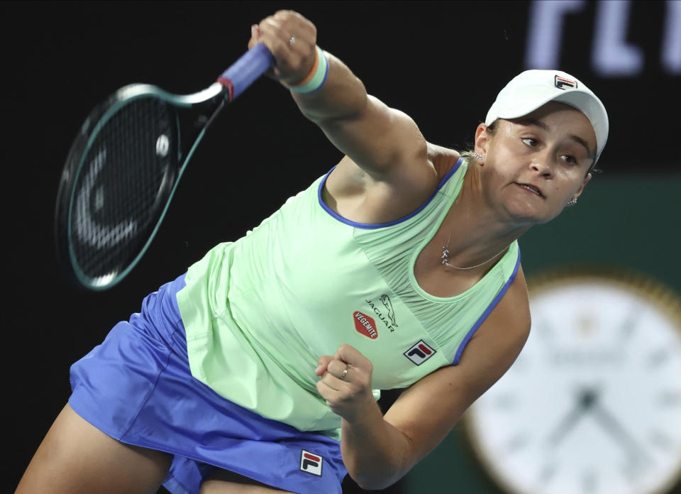 Australia's Ashleigh Barty serves to Lesia Tsurenko of Ukraine during their first round singles match at the Australian Open tennis championship in Melbourne, Australia, Monday, Jan. 20, 2020. (AP Photo/Lee Jin-man)