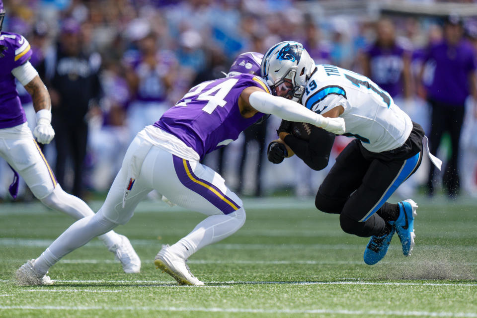 Carolina Panthers wide receiver Adam Thielen is tackled by Minnesota Vikings safety Camryn Bynum during the first half of an NFL football game Sunday, Oct. 1, 2023, in Charlotte, N.C. (AP Photo/Jacob Kupferman)
