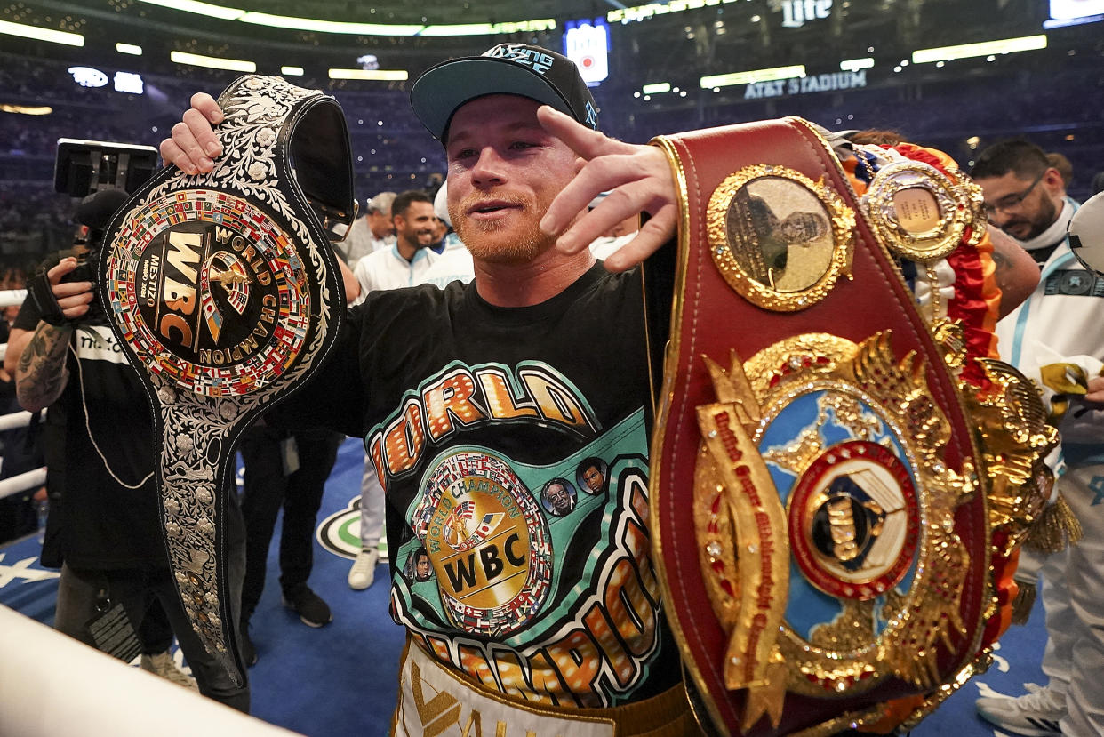 Canelo Alvarez celebrates after defeating Billy Joe Saunders in a unified super middleweight world championship boxing match, Saturday, May 8, 2021, in Arlington, Texas.(AP Photo/Jeffrey McWhorter)