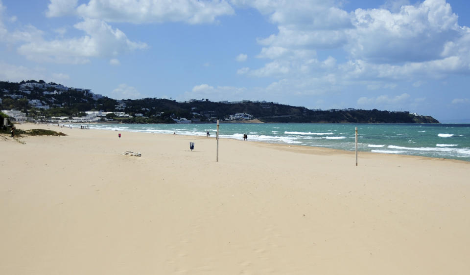 A view of a closed beach in La Marsa, Tunisia, Saturday, July 17, 2021, due to reinstated COVID-19 restrictions. Tunisia is facing its worst coronavirus surge since the pandemic began, further stressing the North African country's already crowded hospitals and health system. That has forced some regions to go back into lockdown and prompted waves of donations of vaccines or medical aid from several countries. (AP Photo/Hassene Dridi)