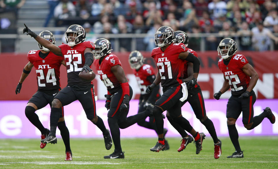 Atlanta Falcons safety Jaylinn Hawkins (32) celebrates making an interception during the first half of an NFL football game between the New York Jets and the Atlanta Falcons at the Tottenham Hotspur stadium in London, England, Sunday, Oct. 10, 2021. (AP Photo/Ian Walton)