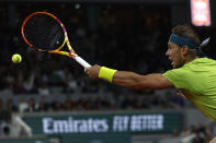 Spain's Rafael Nadal returns the ball to Serbia's Novak Djokovic during their quarterfinal match of the French Open tennis tournament at the Roland Garros stadium Tuesday, May 31, 2022 in Paris. (AP Photo/Jean-Francois Badias)