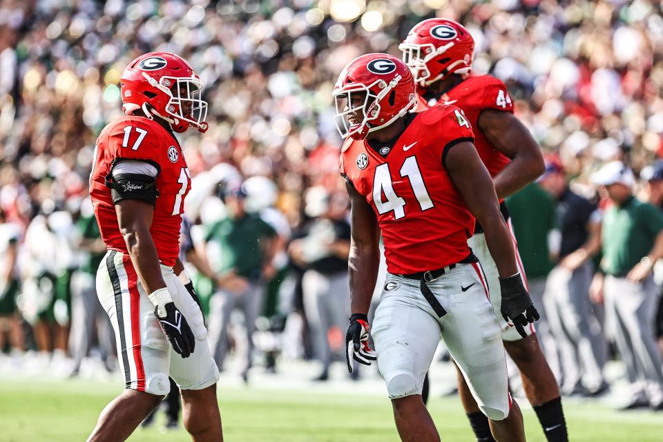 Georgia's Channing Tindall (41) AND Nakobe Dean celebrate against UAB last season.