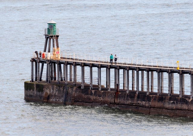 Whitby West Pier in Yorkshire (Danny Lawson/PA)