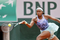 Coco Gauff of the U.S. returns the ball to Belgium's Alison Van Uytvanck during their second round match of the French Open tennis tournament at the Roland Garros stadium Wednesday, May 25, 2022 in Paris. (AP Photo/Jean-Francois Badias)