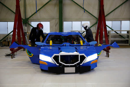 A new transforming robot called "J-deite RIDE" that transforms itself into a passenger vehicle, developed by Brave Robotics Inc, Asratec Corp and Sansei Technologies Inc, demonstrates during its unveiling at a factory near Tokyo, Japan, April 25, 2018. REUTERS/Toru Hanai