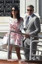 <p>During the couple's wedding weekend in Venice, Amal dressed up in a Giambattista Valli Haute Couture dress and George sported a classic gray suit.</p>