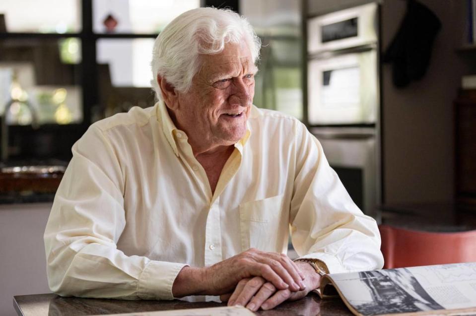 Architect Robin Parker sits in his Coconut Grove kitchen with the May 1965 edition of House Beautiful magazine, dedicated entirely to a Coral Gables home his father, famed architect Alfred Browning Parker, designed and built for his family in 1963. New owners are seeking to demolish the home, considered an architectural masterpiece.