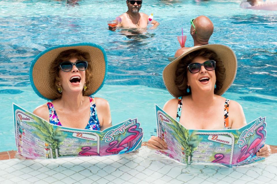 Kristen Wiig and Annie Mumolo hanging out in the pool