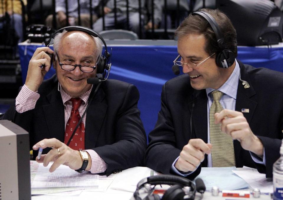 CBS announcers Billy Packer, left, and Jim Nantz laugh during a break in the championship game in the Big Ten basketball tournament in Indianapolis, March 12, 2006. Packer, an Emmy award-winning college basketball broadcaster who covered 34 Final Fours for NBC and CBS, died Thursday night, Jan. 26, 2023. He was 82.