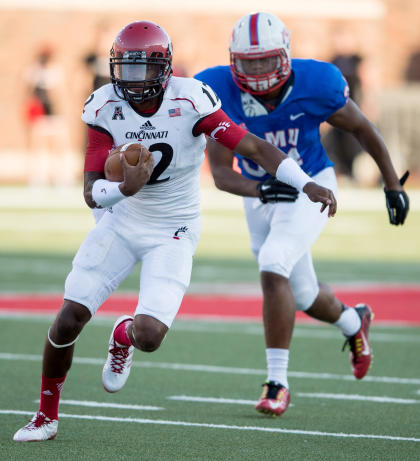 Oct 18, 2014; Dallas, TX, USA; Cincinnati Bearcats quarterback Jarred Evans (12) runs with the ball against the Southern Methodist Mustangs. (Jerome Miron-USA TODAY Sports)