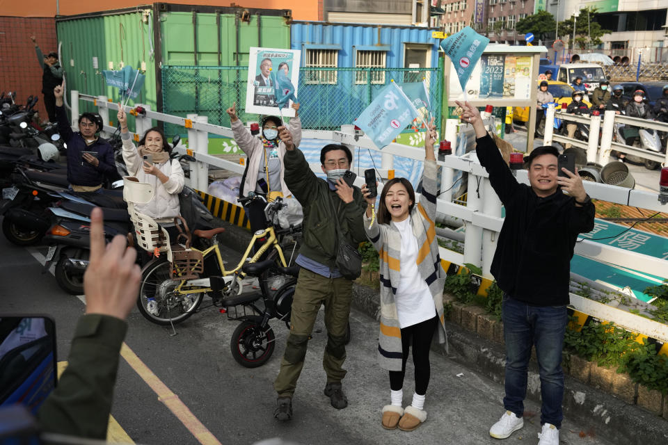 Supporters of Ko Wen-je, Taiwan People's Party (TPP) presidential candidate, cheer as he canvass a neighbourhood in New Taipei City, Taiwan on Wednesday, Jan. 10, 2024. With Taiwan's high-stakes presidential election just days away, the nonconformist candidate has been resonating with the island's youth, seemingly more concerned with the dearth of good jobs and affordable housing than the looming threat from China. (AP Photo/Ng Han Guan)