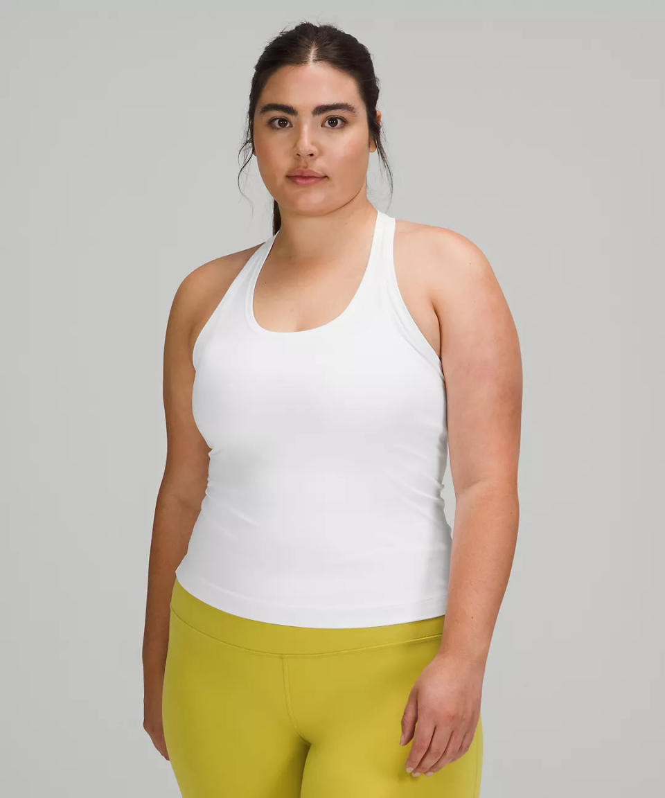 Model wears Cool Racerback Tank Top in white. Image via Lululemon.