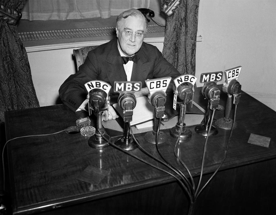 FILE - President Franklin D. Roosevelt speaks on the radio from the Oval Room of the White House, Feb. 27, 1941. (AP Photo/Henry Griffin, File)