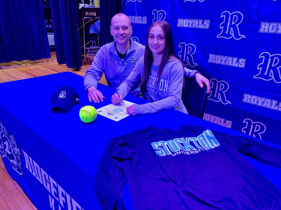 Ridgefield High School senior Taylor Semeraro signed her letter of intent to play softball at Stockton University. Semeraro is joined by her father Troy.