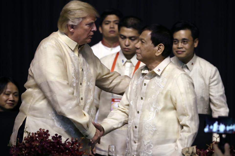 President Donald Trump greets Philippines President Rodrigo Duterte at an ASEAN Summit dinner in Manila in November 2017.