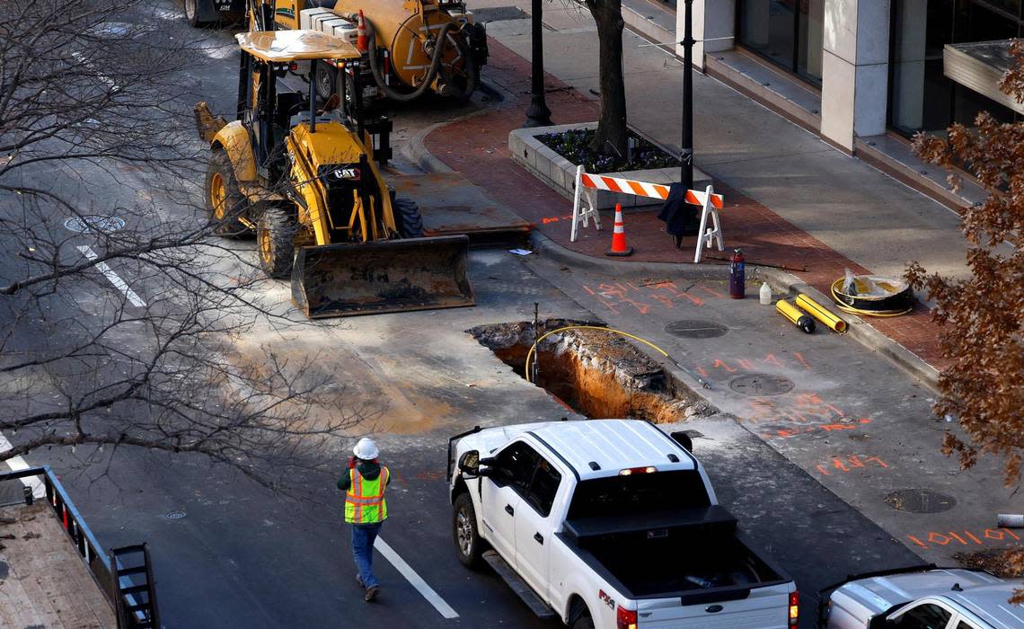 An Atmos Energy crew works on Throckmorton Street to the rear of the Sandman Signature Hotel on Tuesday in downtown Fort Worth.