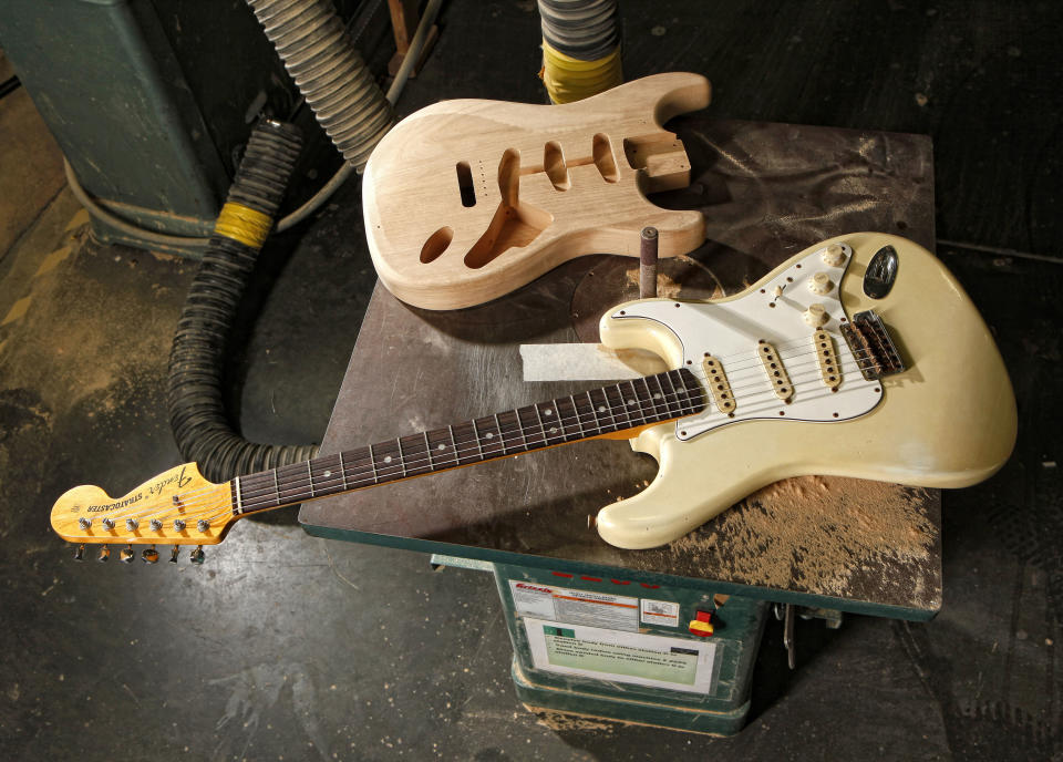 A brand new Fender Stratocaster is shown on a routing machine in the Custom Shop at the Fender factory in Corona, Calif. on Friday, Nov. 19, 2010. The iconic instrument is on display at the Smithsonian National Museum of American History. (AP Photo/Matt York)