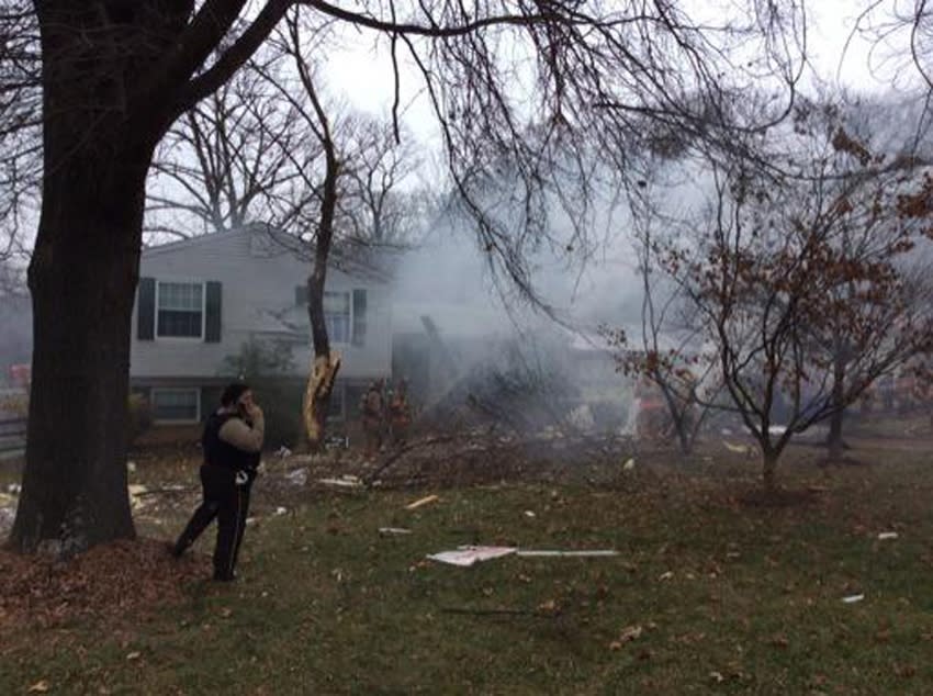 Smoke is seen after a small plane crashed in to a home and damaged others in Gaithersburg, Maryland, in this handout photo provided by the Montgomery County Fire & Rescue Service, December 8, 2014. The plane crashed into a home near the Montgomery County Airpark in Gaithersburg, a Washington suburb, county fire department spokesman Pete Piringer said in a statement. He said that several homes were damaged and on fire and that search and rescue teams were on site. REUTERS/Montgomery County Fire & Rescue Service/Handout (UNITED STATES - Tags: DISASTER TRANSPORT) ATTENTION EDITORS - FOR EDITORIAL USE ONLY. NOT FOR SALE FOR MARKETING OR ADVERTISING CAMPAIGNS. THIS PICTURE WAS PROVIDED BY A THIRD PARTY. REUTERS IS UNABLE TO INDEPENDENTLY VERIFY THE AUTHENTICITY, CONTENT, LOCATION OR DATE OF THIS IMAGE. THIS PICTURE IS DISTRIBUTED EXACTLY AS RECEIVED BY REUTERS, AS A SERVICE TO CLIENTS