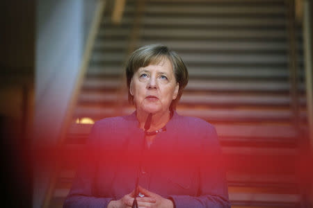 German Chancellor Angela Merkel of the Christian Democratic Union (CDU) makes a statement before the coalition talks at the Social Democratic Party (SPD) headquarters in Berlin, Germany, February 4, 2018. REUTERS/Axel Schmidt