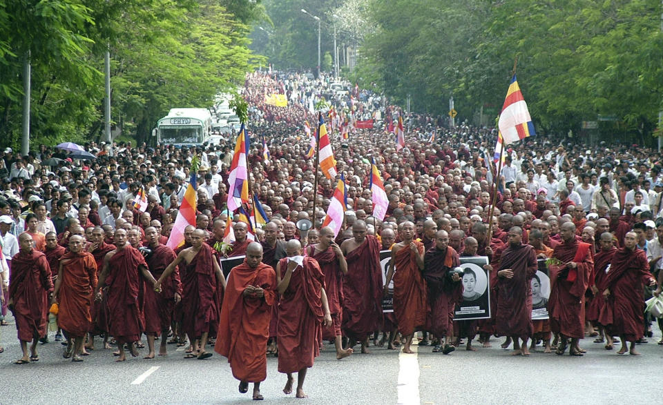 FILE - In this Sept. 24, 2007, file photo, Buddhist monks march on a street to protest the military government in Yangon, Myanmar. Buddhist monks were at the forefront of mass protests in 2007 against the country's military government, and the color of their robes gave the movement its popular Saffron Revolution name. (AP Photo/File)