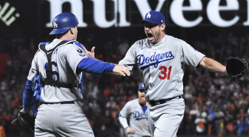 Max Scherzer celebrates with Will Smith after the last out of the National League division series