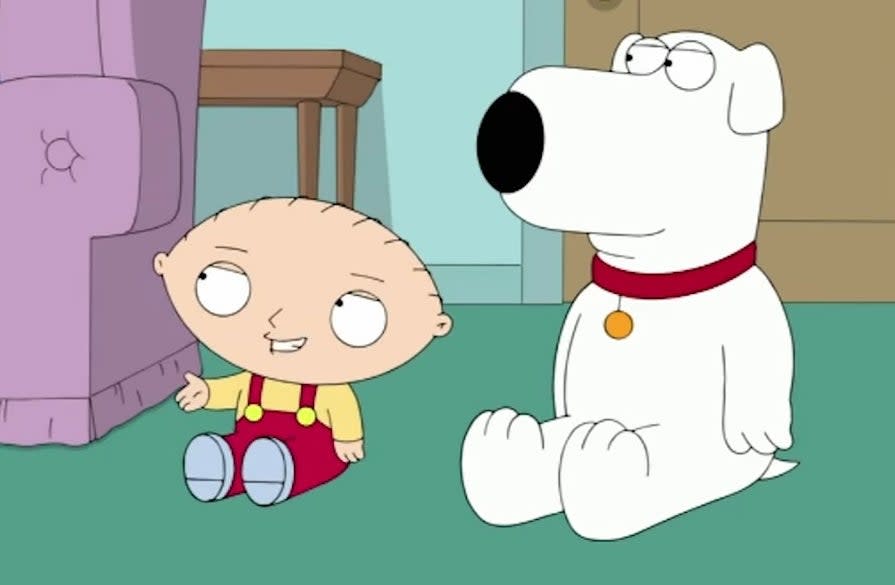 Stewie and Brian sitting on their living room floor in "Family Guy"