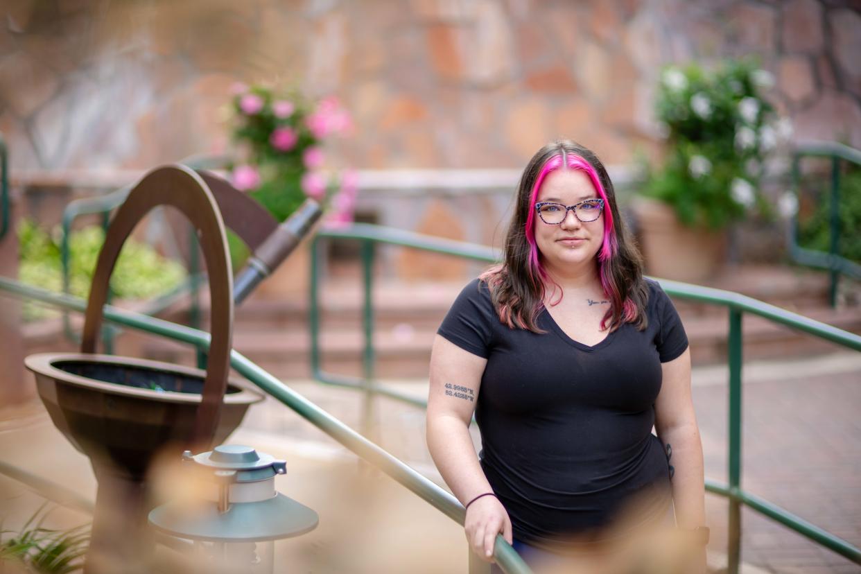 Shaelyn Nielsen is shown in a healing garden in Omaha, Thursday, Aug. 3, 2023. Nielsen says she was sexually abused by a house parent while she was a resident at Boys Town.