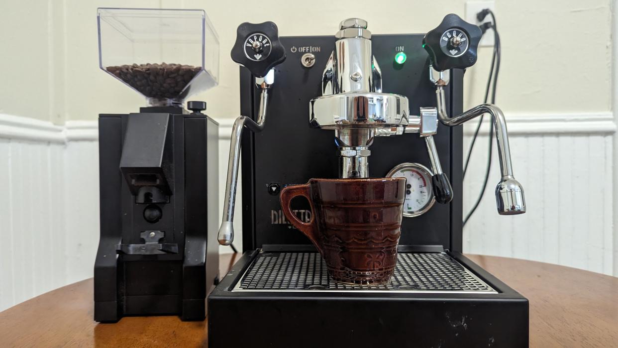  Seattle Coffee Gear Diletta Bello+ Espresso Machine on a table making an espresso. 