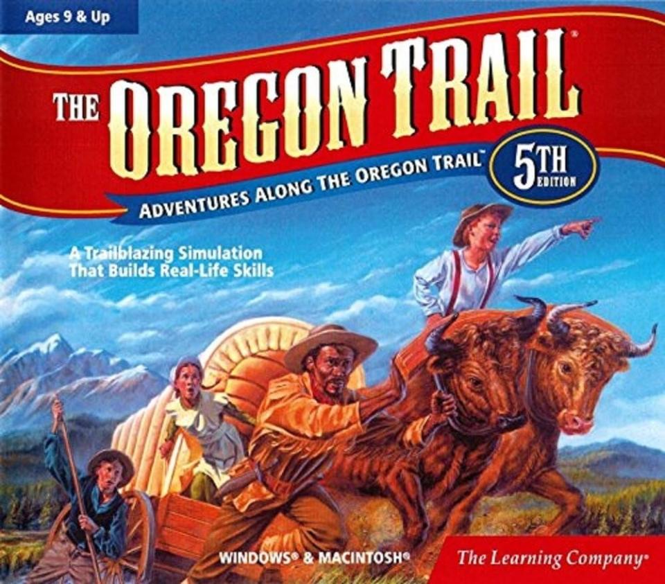 Box art for "The Oregon Trail 5th Edition" game featuring illustrated pioneers and oxen