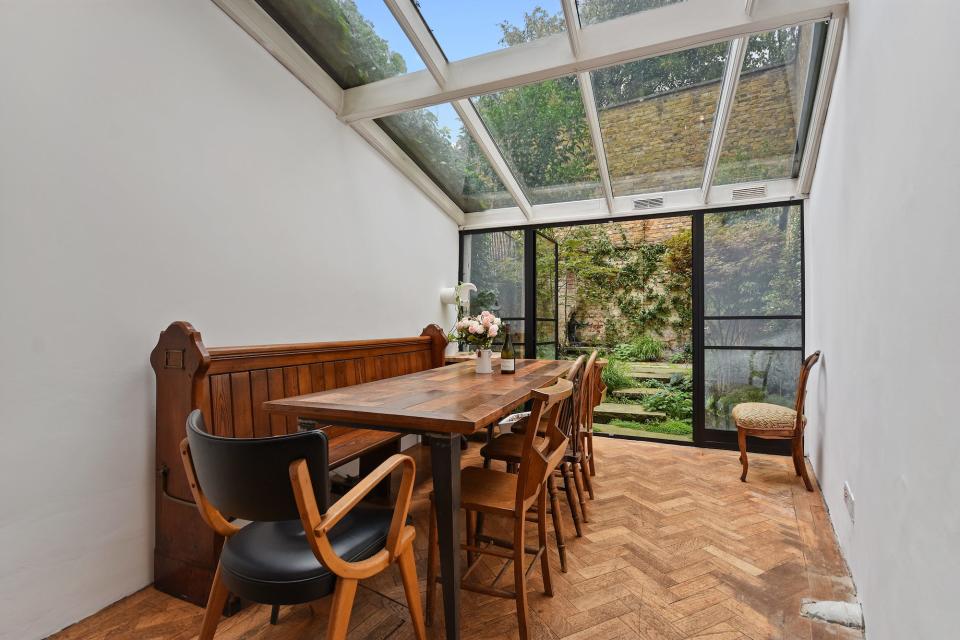 Winkworth skinny house dining room with doors to garden